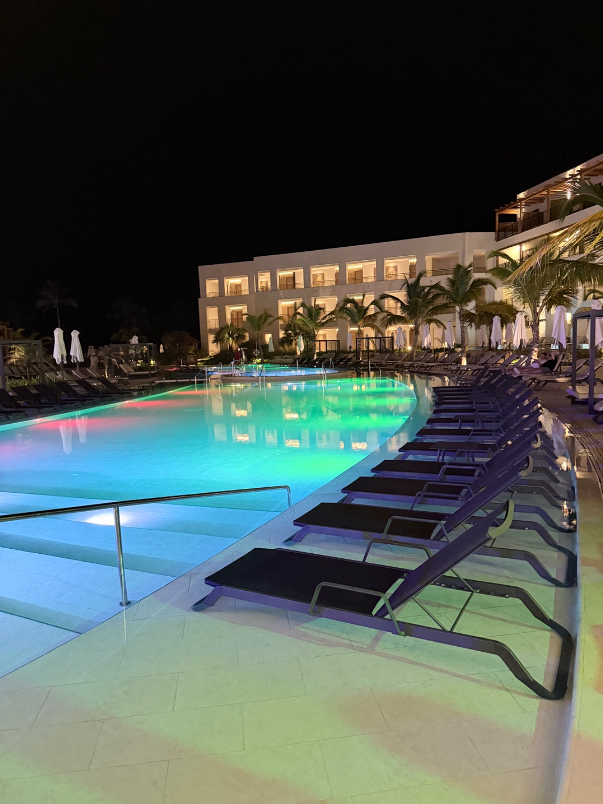The pool at Secrets Playa Esmeralda lit up at night alongside the swim-out suites. Photo: Dreams Fulfilled Travel Dream Designer